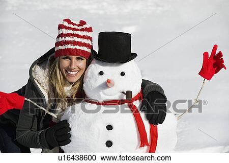 A woman with a snowman View Large Photo Image Stock Image - A woman with a snowman. Fotosearch
