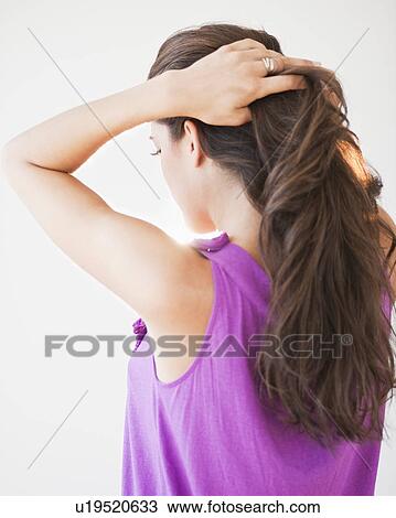 A woman with her back to camera View Large Photo Image Stock Image - A woman with her back to camera. Fotosearch