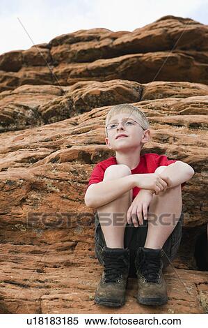 Stock Photography - A young boy at Red Rock. Fotosearch