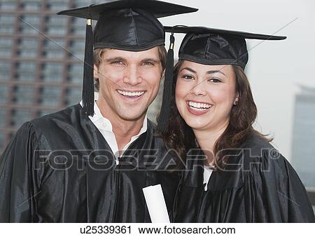A young woman and young man graduating View Large Photo Image Stock Image - A young woman and young man graduating. Fotosearch