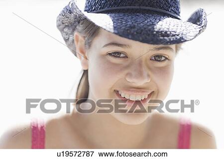 Stock Photo - A young woman outdoors smiling. Fotosearch