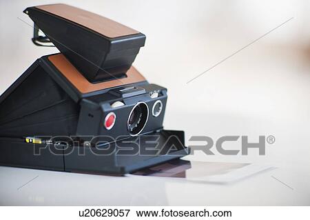 An old fashioned camera View Large Photo Image Stock Photo - An old fashioned camera. Fotosearch