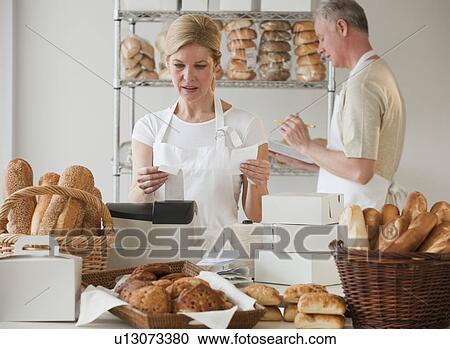 Stock Image - Bakers in a bakery. Fotosearch