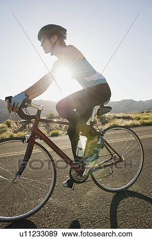 Stock Photo - Biker on the road. Fotosearch