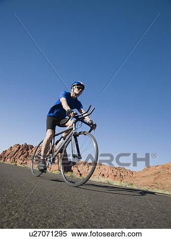 Biker on the road View Large Photo Image Stock Photography - Biker on the road. Fotosearch