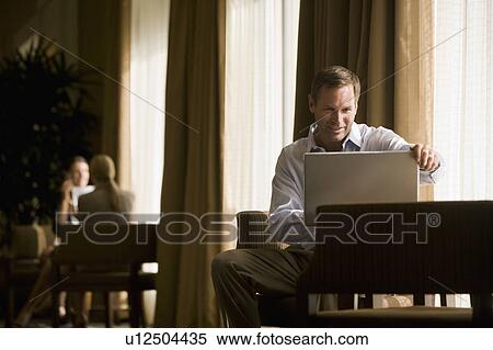 Business people in a lobby View Large Photo Image Stock Photography - Business people in a lobby. Fotosearch