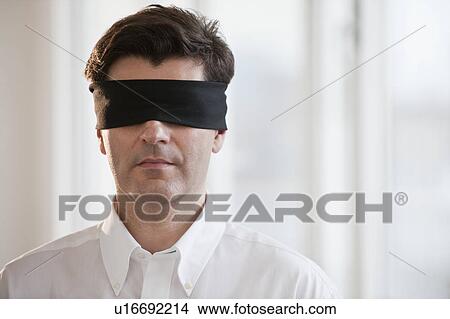 Businessman wearing blindfold View Large Photo Image Picture - Businessman wearing blindfold. Fotosearch
