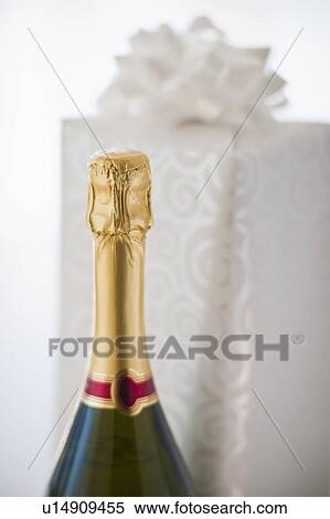 Champagne and a gift View Large Photo Image Stock Photography - Champagne and a gift. Fotosearch