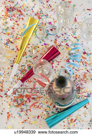 Champagne bottle and party supplies View Large Photo Image Stock Photo - Champagne bottle and party supplies. Fotosearch
