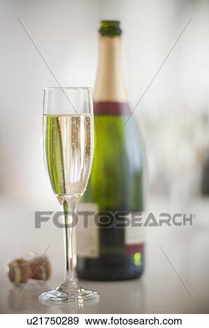 Champagne flute and bottle View Large Photo Image Stock Photo - Champagne flute and bottle. Fotosearch
