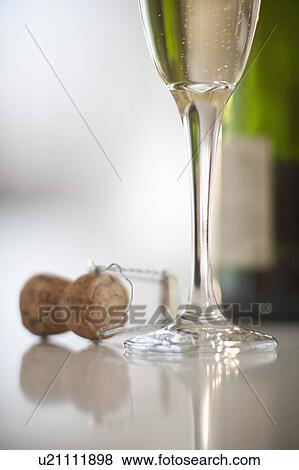 Stock Photo - Champagne flute and cork. Fotosearch