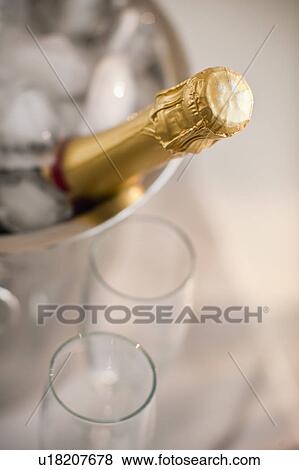 Champagne in a bucket with glasses View Large Photo Image Stock Photo - Champagne in a bucket with glasses. Fotosearch