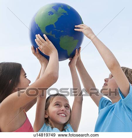 Children holding a globe View Large Photo Image Stock Photo - Children holding a globe. Fotosearch