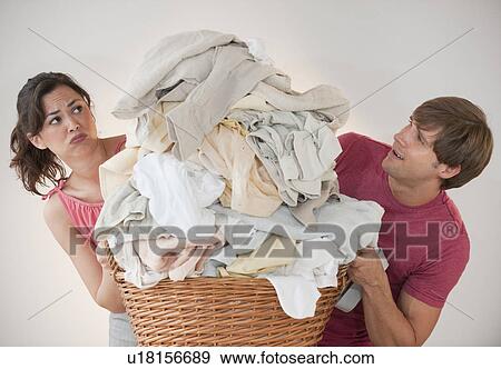 Couple doing laundry View Large Photo Image Stock Photo - Couple doing laundry. Fotosearch
