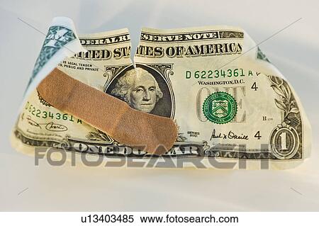 Crumpled dollar bill with a band aid View Large Photo Image Stock Photography - Crumpled dollar bill with a band aid. Fotosearch