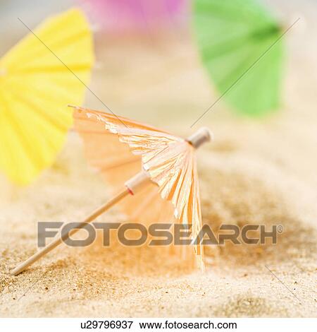 Drink umbrellas on sand View Large Photo Image Stock Photo - Drink umbrellas on sand. Fotosearch