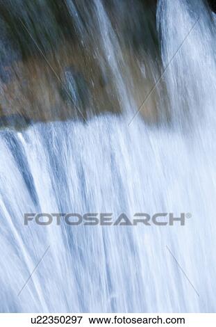 Stock Photo - Flowing creek. Fotosearch