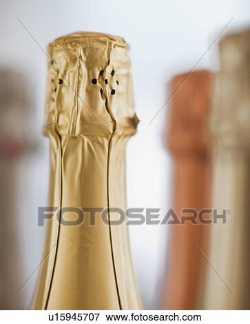 Stock Photo - Four champagne bottles. Fotosearch