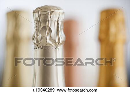 Stock Photo - Four champagne bottles. Fotosearch