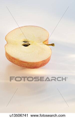 Stock Image - Half of an apple. Fotosearch