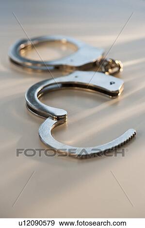 Hand cuffs View Large Photo Image Stock Photo - Hand cuffs. Fotosearch