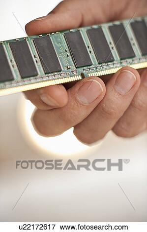 Hand holding computer chips View Large Photo Image Stock Photo - Hand holding computer chips. Fotosearch