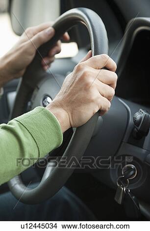 Hands on a steering wheel View Large Photo Image Picture - Hands on a steering wheel. Fotosearch