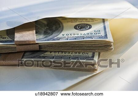 Hundred dollar bills in an envelope View Large Photo Image Stock Photo - Hundred dollar bills in an envelope. Fotosearch