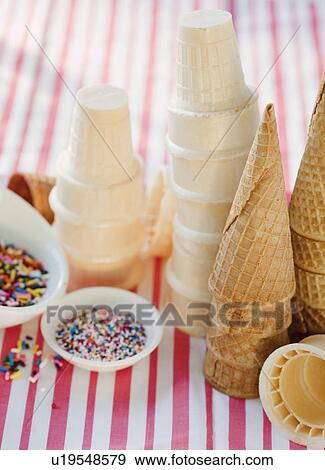 Ice cream cones and sprinkles View Large Photo Image Stock Photo - Ice cream cones and sprinkles. Fotosearch