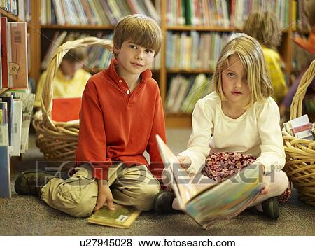 Kids in a library View Large Photo Image Stock Photo - Kids in a library. Fotosearch