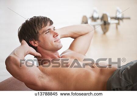 Man doing sit ups View Large Photo Image Stock Photography - Man doing sit ups. Fotosearch