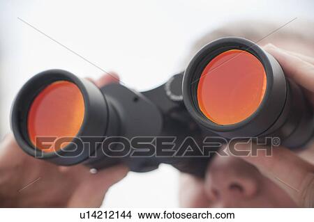 Man using binoculars View Large Photo Image Picture - Man using binoculars. Fotosearch