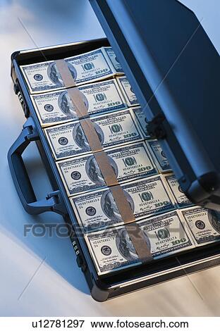Money in a briefcase View Large Photo Image Stock Photo - Money in a briefcase. Fotosearch