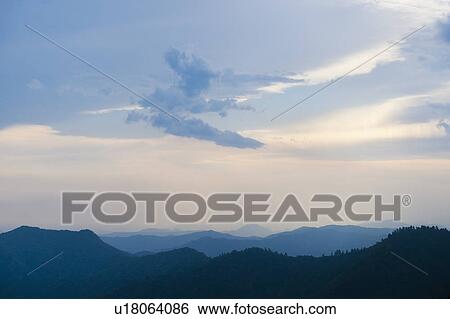 Stock Photograph - Mountain landscape with trees. Fotosearch