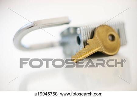 Padlock and key View Large Photo Image Stock Photo - Padlock and key. Fotosearch