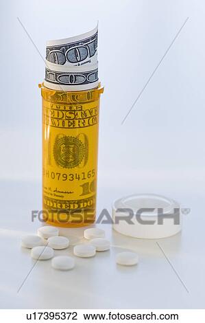 Pill bottle with bank notes View Large Photo Image Stock Image - Pill bottle with bank notes. Fotosearch