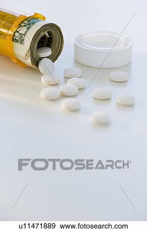 Stock Photo - Pill bottle with bank notes. Fotosearch