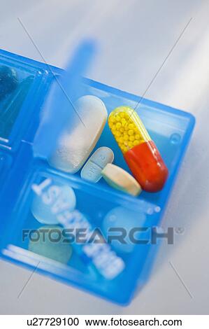 Stock Image - Pill dispenser. Fotosearch