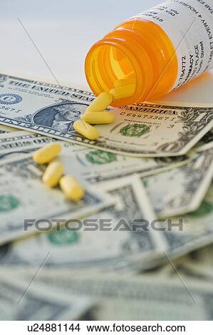 Pills on bank notes View Large Photo Image Picture - Pills on bank notes. Fotosearch