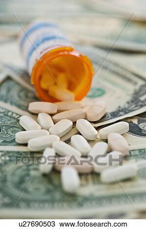 Pills on bank notes View Large Photo Image Stock Image - Pills on bank notes. Fotosearch