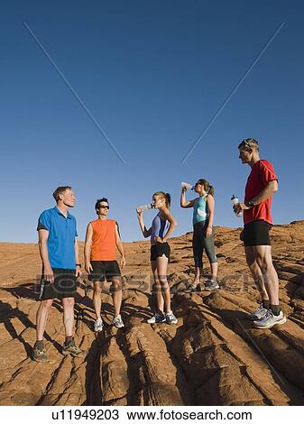 Stock Image - Runners at Red Rock taking a break. Fotosearch