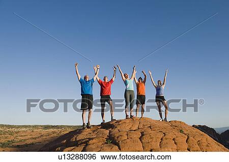 Stock Photograph - Runners at Red Rock taking a break. Fotosearch