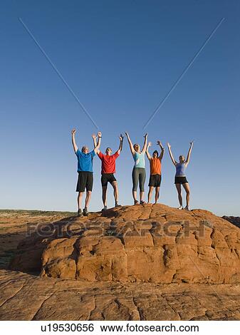 Stock Photograph - Runners at Red Rock taking a break. Fotosearch