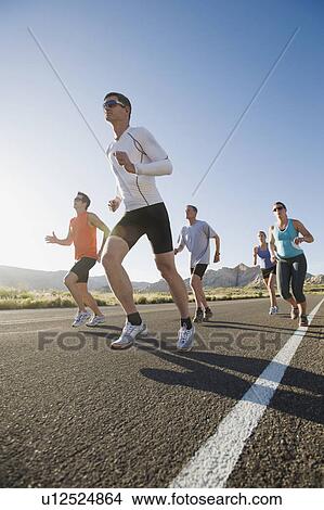 Picture - Runners on a road. Fotosearch