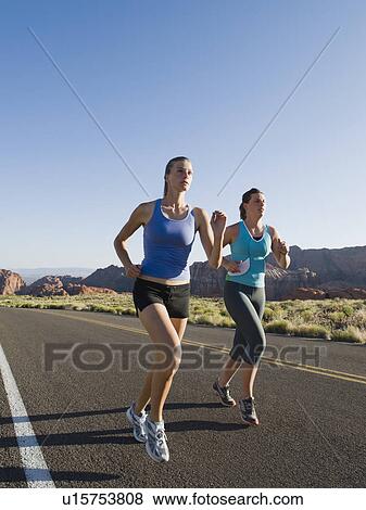 Stock Photo - Runners on a road. Fotosearch