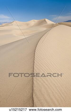 Sand dunes in the desert View Large Photo Image Stock Photo - Sand dunes in the desert. Fotosearch