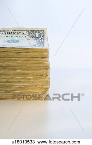 Stock Image - Stack of dollar bills. Fotosearch