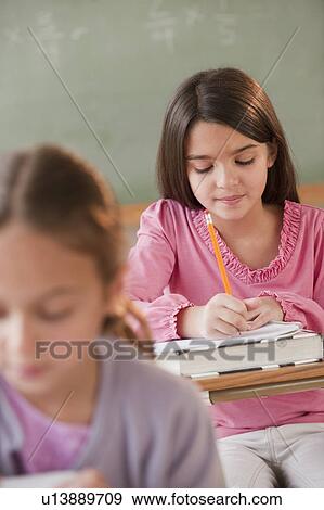 Stock Photo - Students in a classroom. Fotosearch