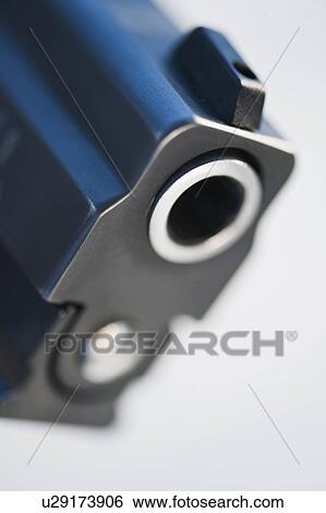 Stock Photograph - The barrel of a handgun. Fotosearch
