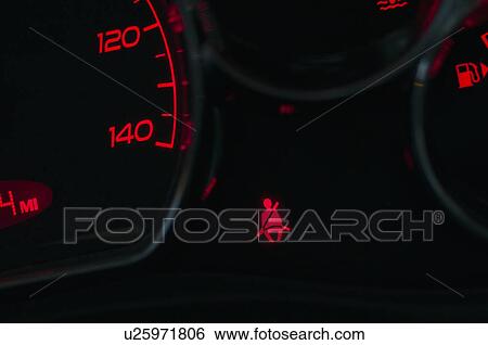 The seat belt warning on the dashboard of a car View Large Photo Image Stock Photograph - The seat belt warning on the dashboard of a car. Fotosearch